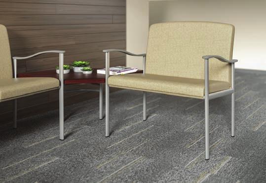 A coordinating footstool pulls out to support legs and stores beneath the chair when not in use.