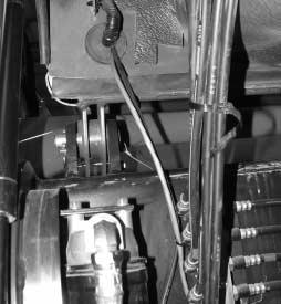 Add any required cable ties (#) to contain wire harness (#) in the engine room and under the cab. None were required in this situation as the weaving through the hoses contained the harness.