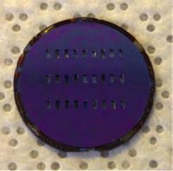 tack-bonded to the port plate using photoresist (see Fig. 2), then the resulting assembly was mechanically clamped in a clam shell package in the test stand.