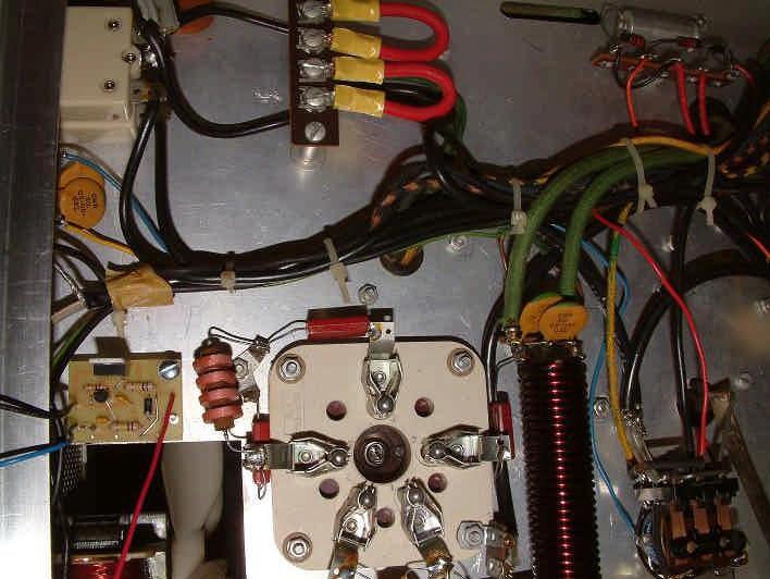Pass the RED wire from the SK-220 circuit board under all of the wiring toward the front of the chassis to the