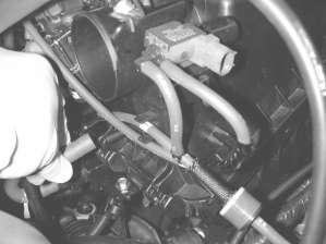h) Remove the vacuum line from the auxiliary intake air control vacuum diaphragm.