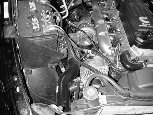e) Remove the air box and inlet hose from the vehicle.