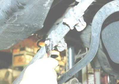 17. Place the smaller supplied bracket into the axle trackbar mount 18.