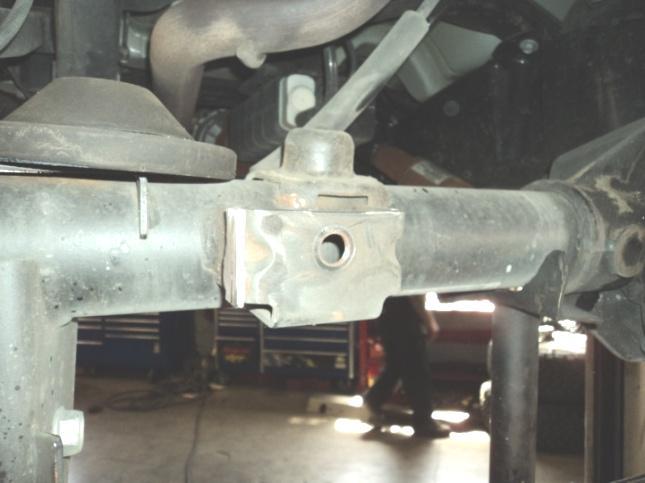 Spray lubricant on rubber hangers, pry hangers from frame. 83. On passenger side rear exhaust hanger at frame. Bend hanger upwards about ¾ with pry bar. 84.