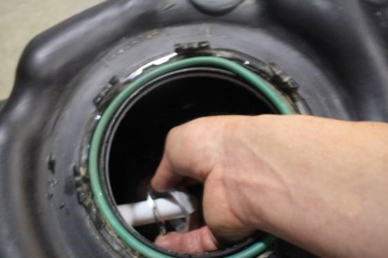 Drill a 1 3/8 hole, catching all debris. De-bur hole and remove any missed debris in the fuel tank. K.