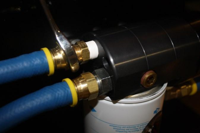Route fuel line from the R fitting of the suction tube assembly to the R port on the FASS system with a