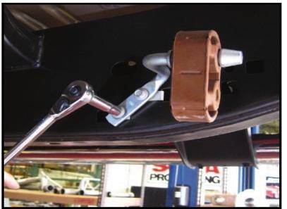 3. Locate the intermediate pipe assembly, and the muffler hanger mount, along with the two 10mm mounting bolts.