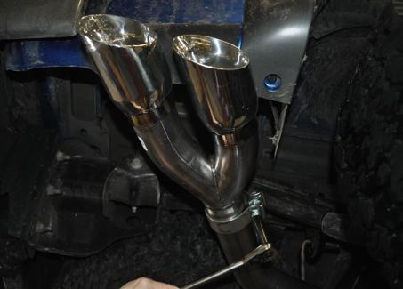 10. Locate the tip assembly. Slide a clamp over the expanded end of the tip, and onto the end of the tailpipe.