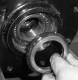 If the bearings do not roll smoothly when rotated, replace them.