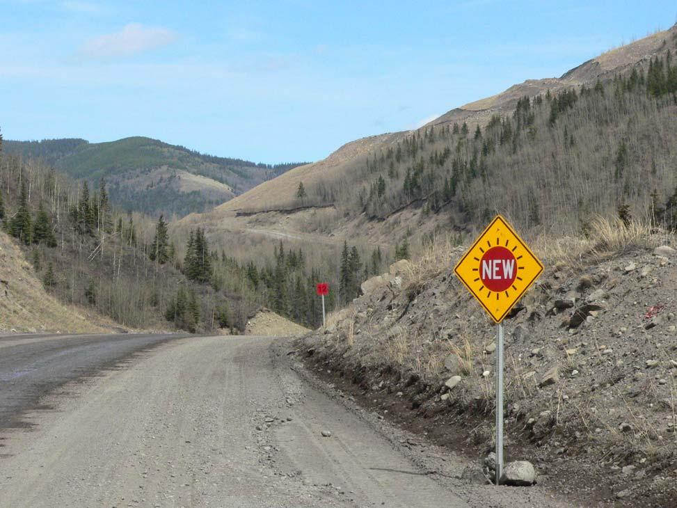 File: F - 248276 Attachment B Page 15 of 18 Photograph #15 Shows the addition of signage on the Mine Haul Road at the north end of the Sheep Creek