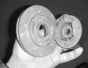 Impeller Replacement To remove the impeller from the inner drive magnet, gently pry off by hand or lightly tap on the back of the impeller. See figure 28.