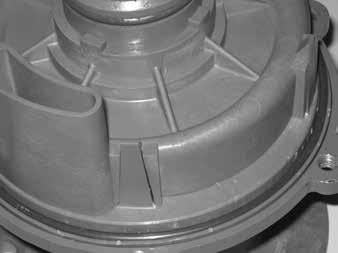 Install the inner volute (item 7) by lining up the prongs of the barrier with the channels in the inner volute.