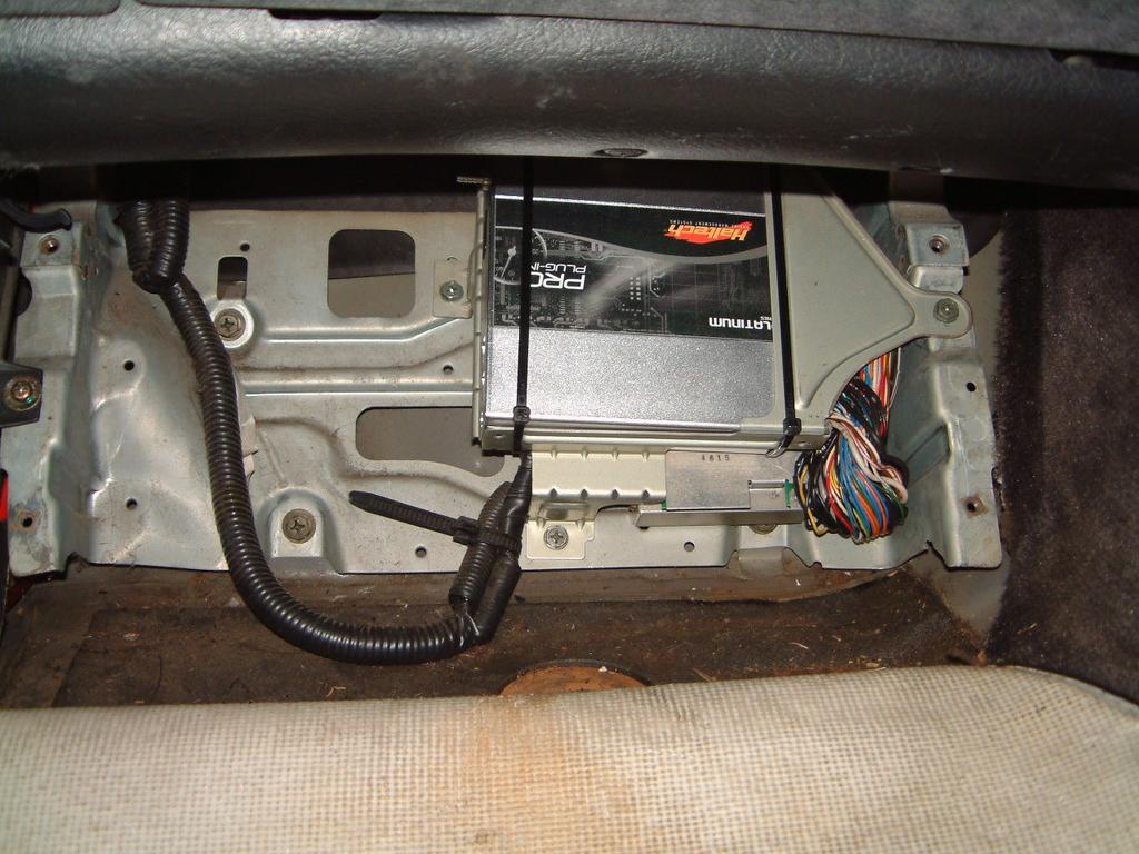 Be sure to pull the connector out squarely so as not to cause any damage to the pins or wires. With the connector disconnected the ECU can be removed from the vehicle.
