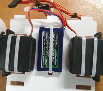 Figure 1-5 Battery mounted to the chassis 6. Finally, add the breadboard. Mount this across the point you put the skid cable tie so the board holds the skid down.