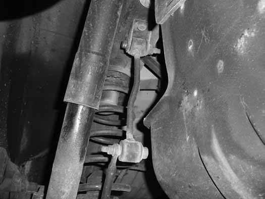 6. Support the axle with a hydraulic jack. Remove the rear shocks. Save hardware. 7. Disconnect the rear sway bar links from the sway bar and the frame.
