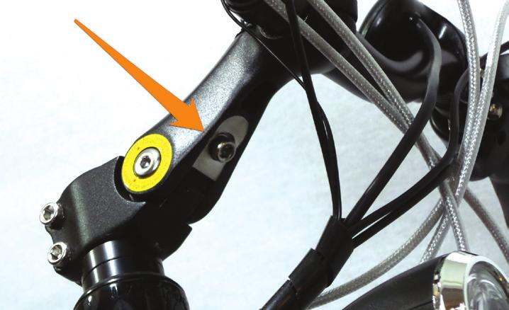 Stem Adjustment To adjust the handlebars to a customized height: Loosen the bolt indicated by the arrow in Fig. 10. Access this bolt from underneath the handlebars.