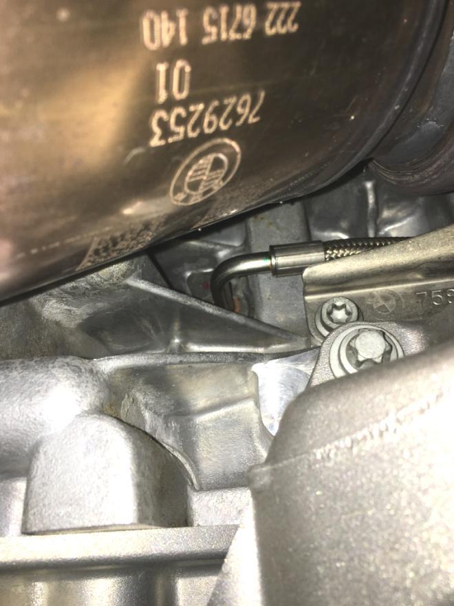 Figure 20). Remove the single bolt holding this line to the engine block and pull it out of the block. This is some tricky.