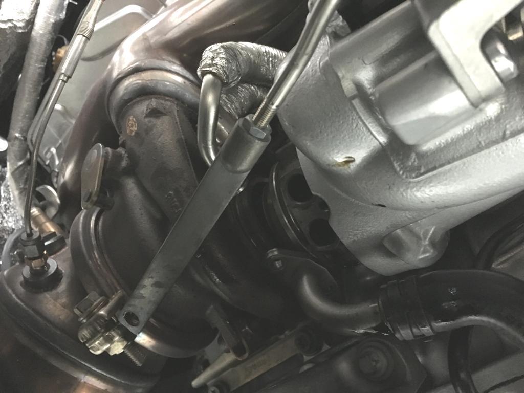 With the clamp removed, gently pull the turbo forward and off of the manifold about an inch.