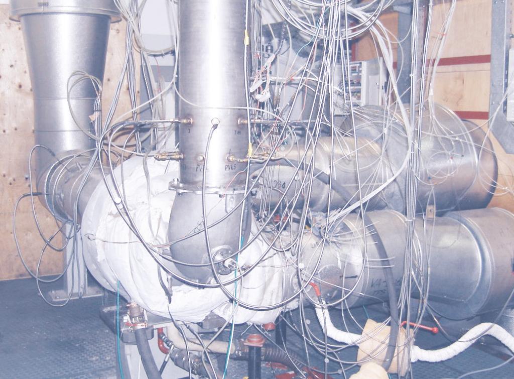 were measured on a combustion test rig.figure 7 shows the test rig equipment for material temperature measurements of a compressor stage with impeller cooling. 3.