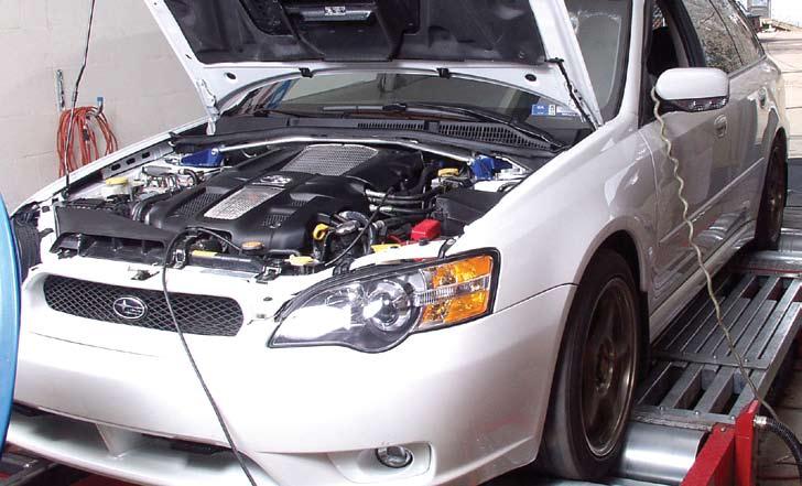 Typical testing for improving the tune up on grocery getters is a normal application for chassis dynos. This photo shows an AWD Subaru wagon undergoing a power test.