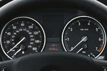 As the lane ahead clears, the system auto matically returns the car to the set speed. 2 Instrument panel features a red backlit speedometer and tachometer.