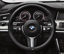 Sport multi-function leather steering wheel,, three-spoke, with Chrome inserts.