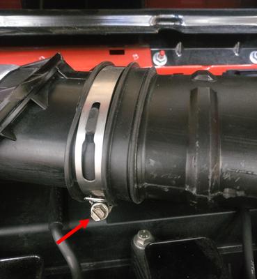 Loosen the worm clamp connecting the two sections of intake tube using a 7mm