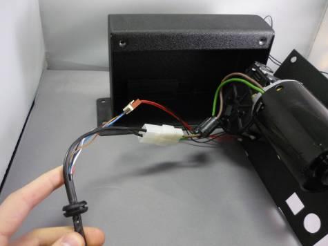 Carefully disconnect the power (green and brown wire) and reed switch (red and black wires) from the