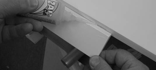 Keeping the aileron, flap, and wing in position, apply 3 or 4 drops of thin CA to the small exposed area of each hinge.