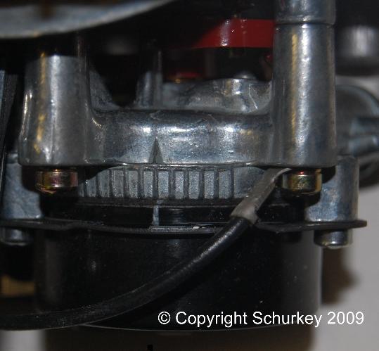 A few carburetors were built with a water passage in the choke housing; heated engine coolant warms the choke coil.