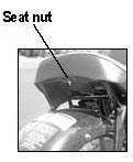 CHECKING & CLEANING THE AIR FILTER 1. Remove seat to access air filter. Seat is removed by removing nut located under seat (see photo). 2. Locate Air Filter Box under seat and remove cover. 3.
