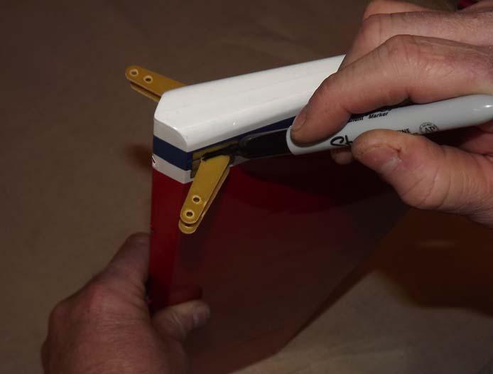 21. Before applying epoxy, measure the control horns to ensure they are centered properly and mark their