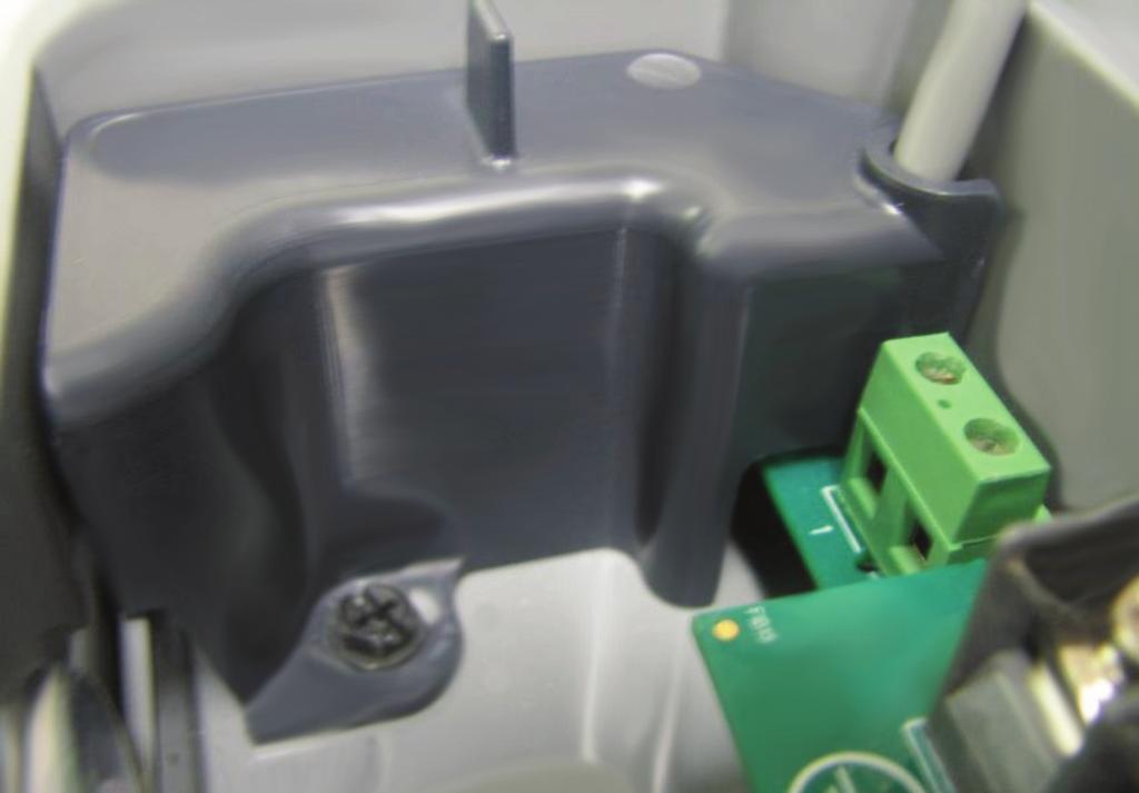 Figure 15: Plastic Cover Installed In Terminal Box G. Replace the metal terminal box cover.