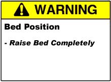 If the bed is lowered below the mid position with the loader down, you mush switch to Manual Mode to raise the loader before you can continue.