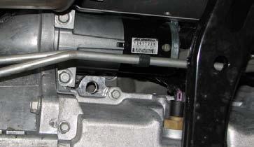 63. Use a 13mm socket (10mm on 2013 model years) to remove the two bolts holding the fan assembly to the top of the radiator then disconnect the electrical connector on the passenger side of the fan