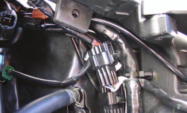 5 Route the PCV harness underneath the fuel tank bracket as shown in Figure A. FIG.