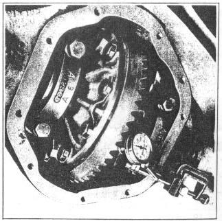 11-26 REAR AXLE 30. Turn screw on housing spreader J-5231 and with dial indicator mounted as shown in Figure 40, spread housing.020" to permit installation of differential.