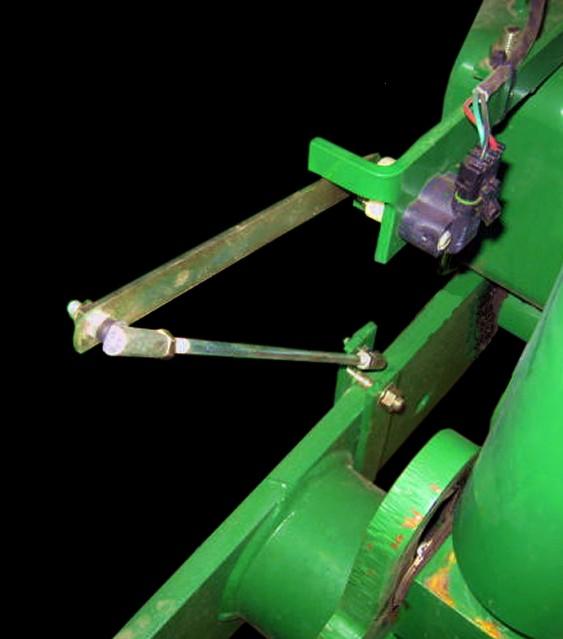 This sensor will be mounted directly to the frame and one of the carriage wheels of the planter as shown.