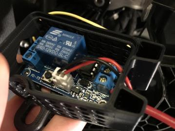 Step 5 (cont.): E. Route the white connector on the button harness through the opening in the relay case and connect it as shown in Fi