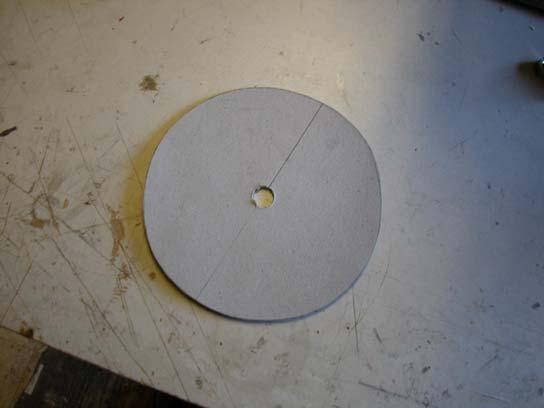 Make a circle on some remaining card stock the same dimension of the cowl opening. Drill a hole on the center for your propeller shaft.
