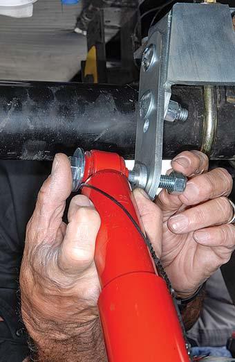 1) The shock is then loosely installed to the lower shock mount extension using ½ x 1¾- inch-long bolts.