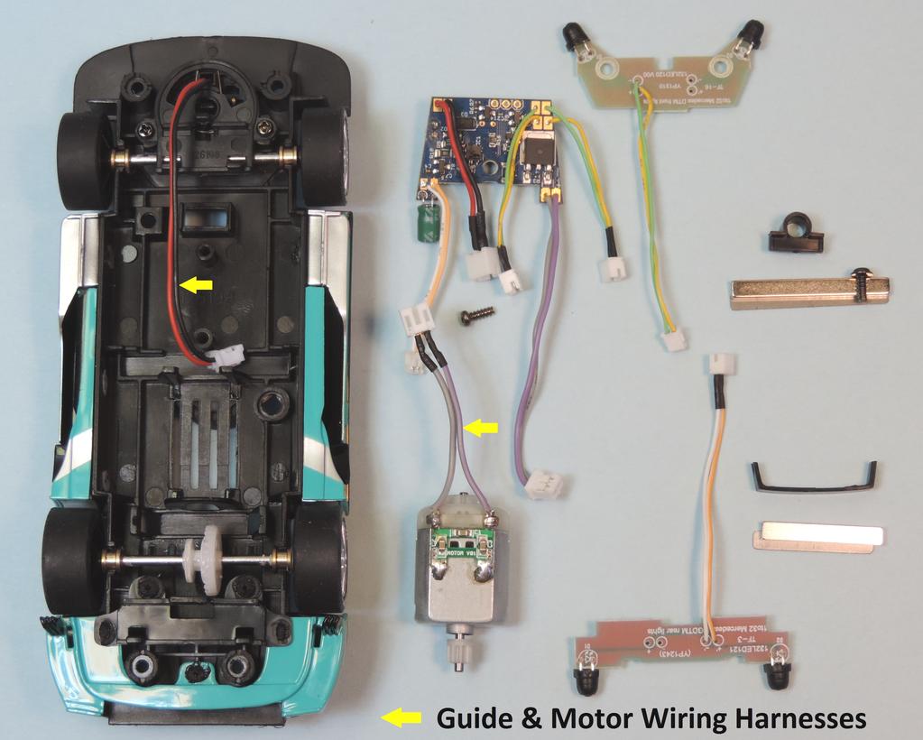 The stock guide and motor wiring harnesses are to be retained and utilized.