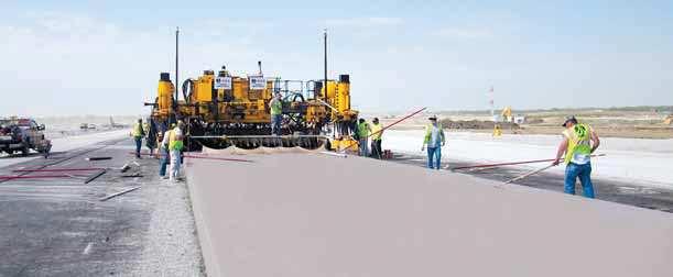 two-track GHP-2800 paver is equipped with Leica Geosystems 3D guidance to slipform a