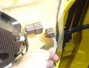 The speaker wire is the last connection on this vehicle that must be released, but other variations may have more than one speaker connection and / or