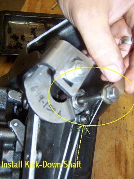 Then you must hold the smaller clamp in position (facing same way as original which was originally seen before removal) then take the Shiftworks Kick-Down Shaft and place it back inside the