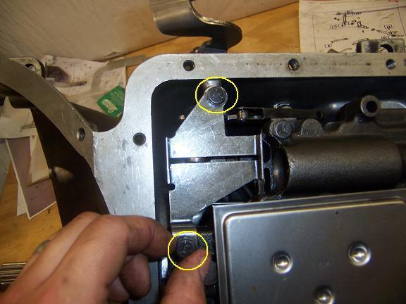 Now you will attach the Roller Retainer Plate and Spring.