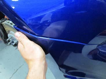 STEP 28: Clip the outer edges of the front fascia to the fender fascia brackets.