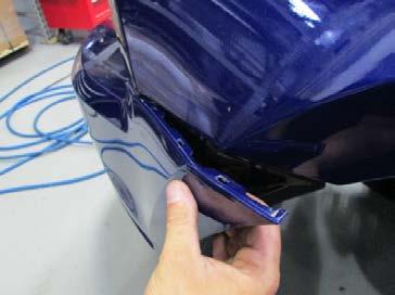 STEP 17: Gently unclip the outer edges of the front fascia from the