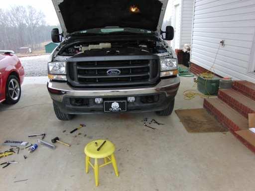 Reinstall the bumper and plug the wiring harness into the fog lights as you install