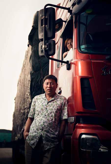 Today, his team is assembling DFCV s red Kingland long-haul truck. The colour red is considered lucky in China.